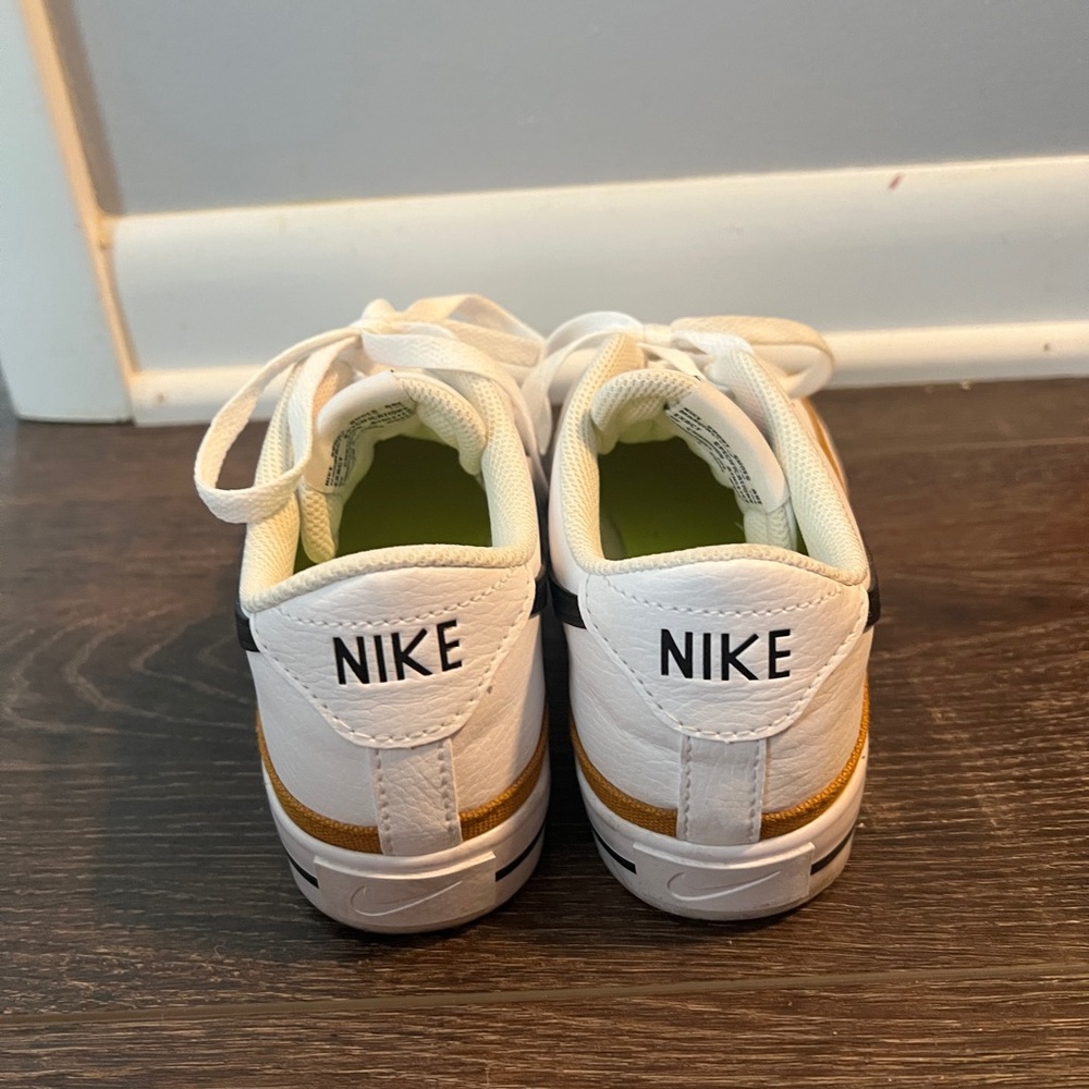 Nike White and Black Sneakers with Gold Accents - Picture 3 of 3